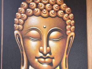 Gold Buddha on stony medium